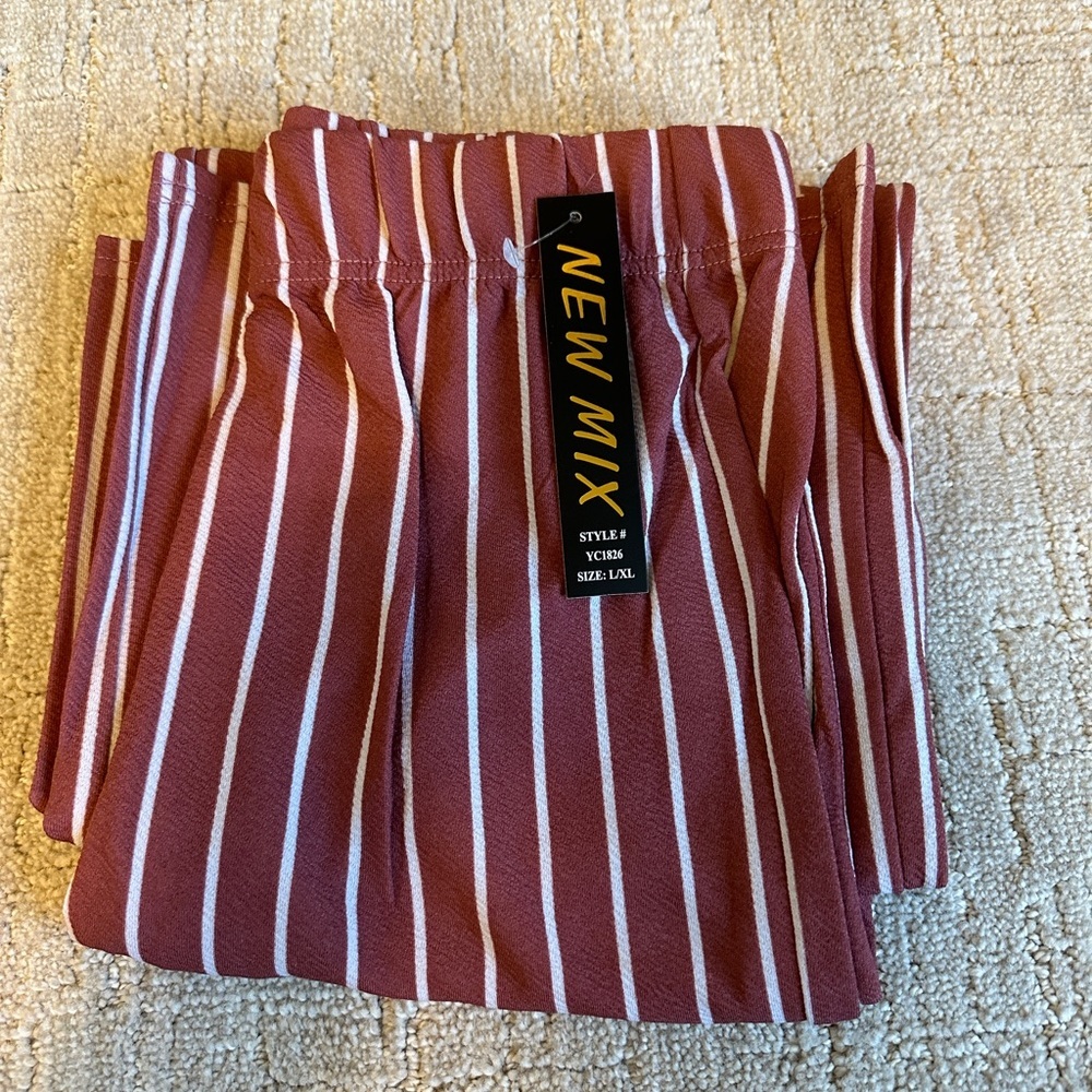 Vertical striped flowy pant. Maroon with white stripe, elastic waist.